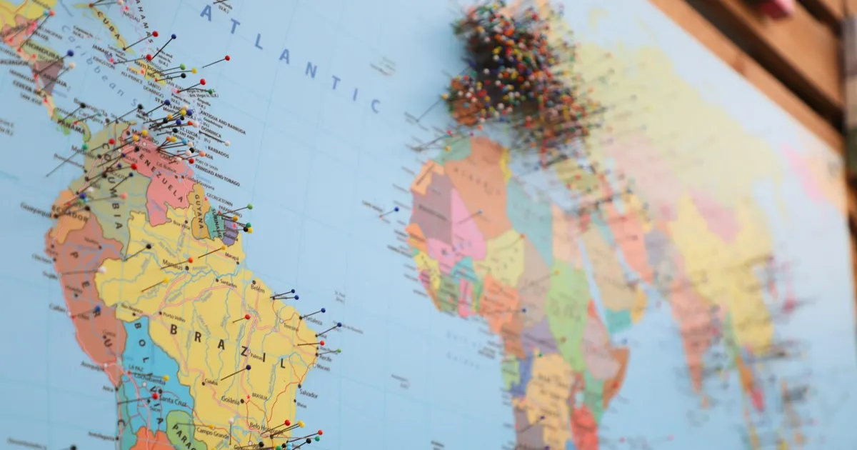A world map marked with coloured location pins